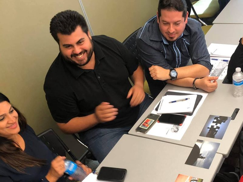 Team members in conversation during a development program